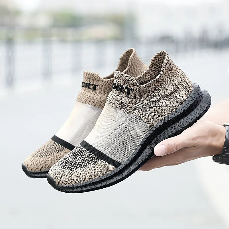 Casual grey Flyknit sock shoes with laces and a low-top MD sole, shown on a foot.