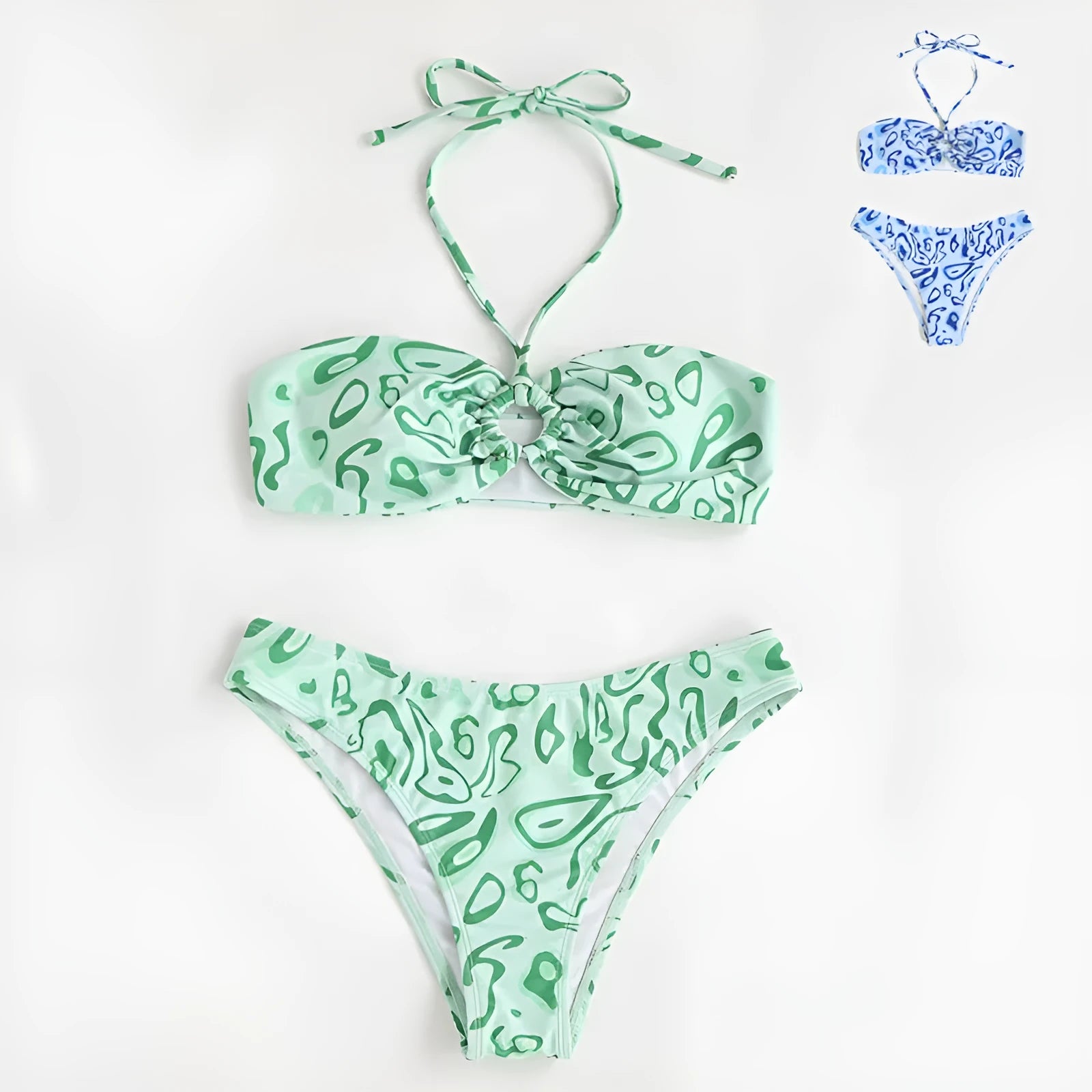 Women's blue floral bandeau bikini swimsuit with split design on beach background