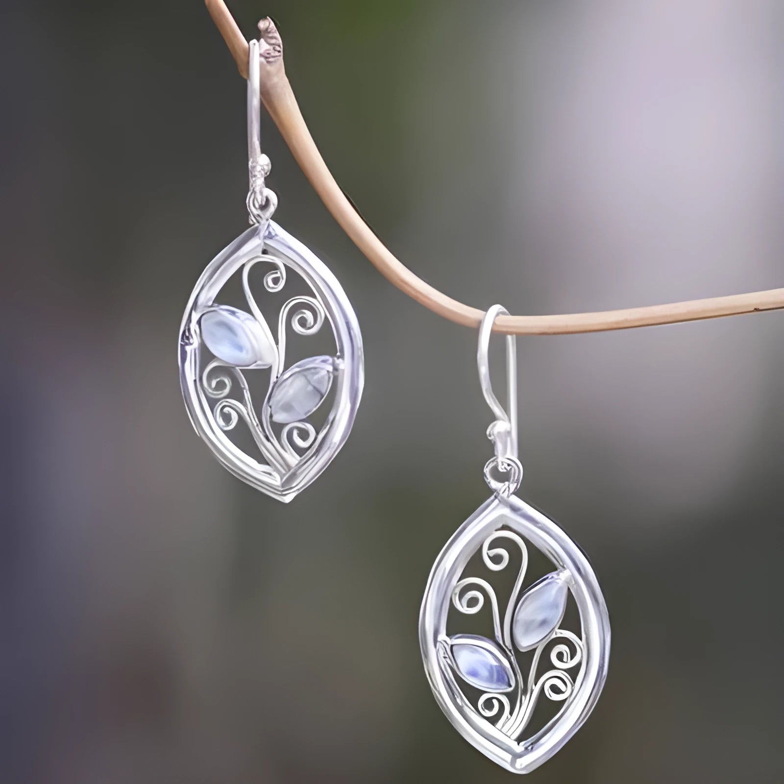 Silver colour leaves embedded colourful moonstone earrings for women with alloy construction