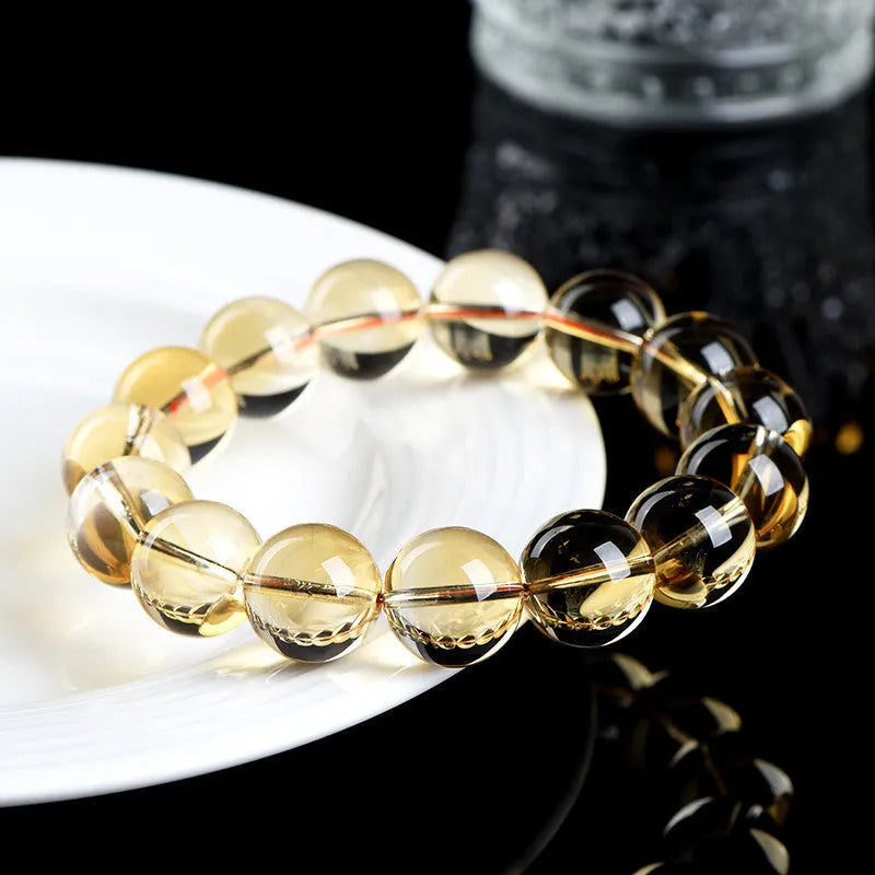 Natural citrine scattered beads ball bracelet showing 7A and 6A colour grade options on a wrist.
