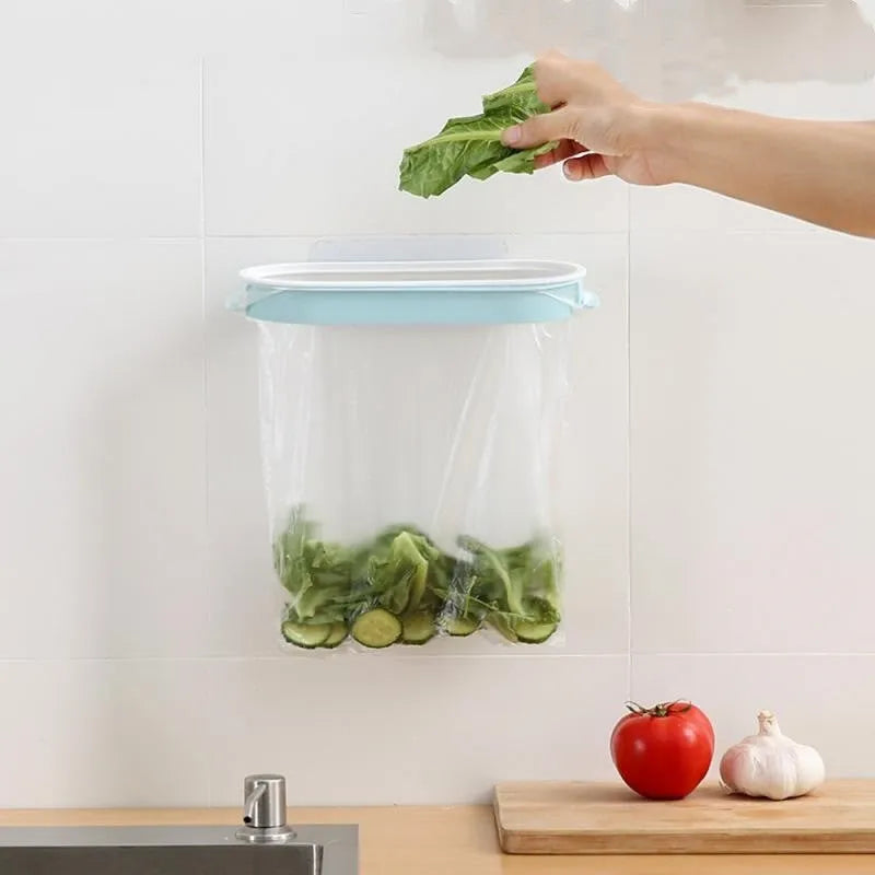 Blue plastic kitchen garbage bag storage rack on a worktop.