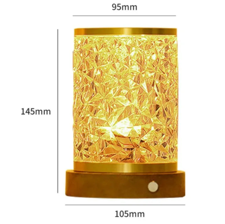 Small rotating water ripple effect night light with a solid wood base on a table