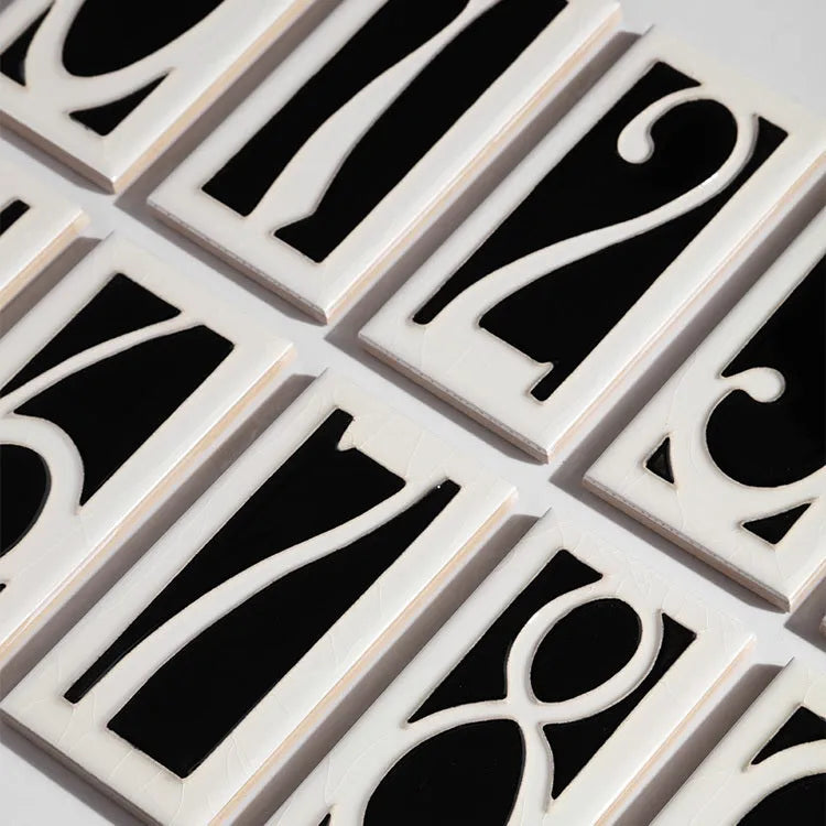 Handmade enamel glazed ceramic retro doorplate measuring 76 by 152mm, showing sample number and Flower Patch styles.
