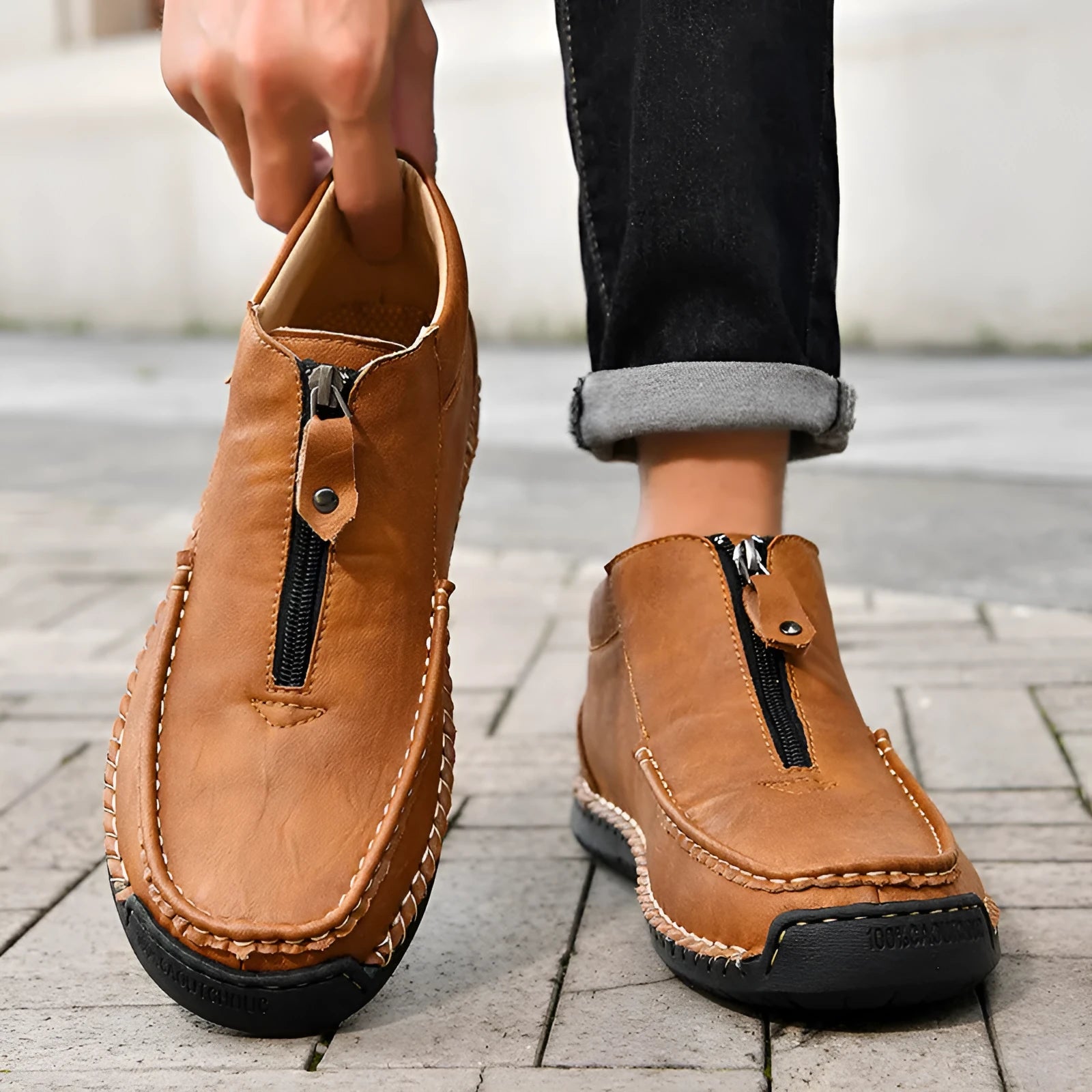 Men's black slip-on casual loafers with round toe and rubber sole.
