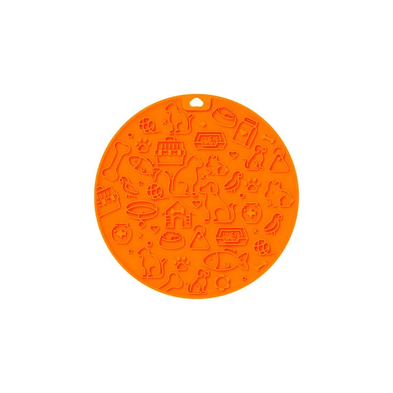 Round silicone pet licking mat with suction cup base in blue colour on a kitchen floor