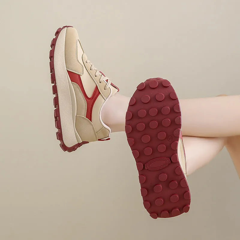 Women's solid colour platform sports running shoes with mesh upper and rubber sole in three colour options.