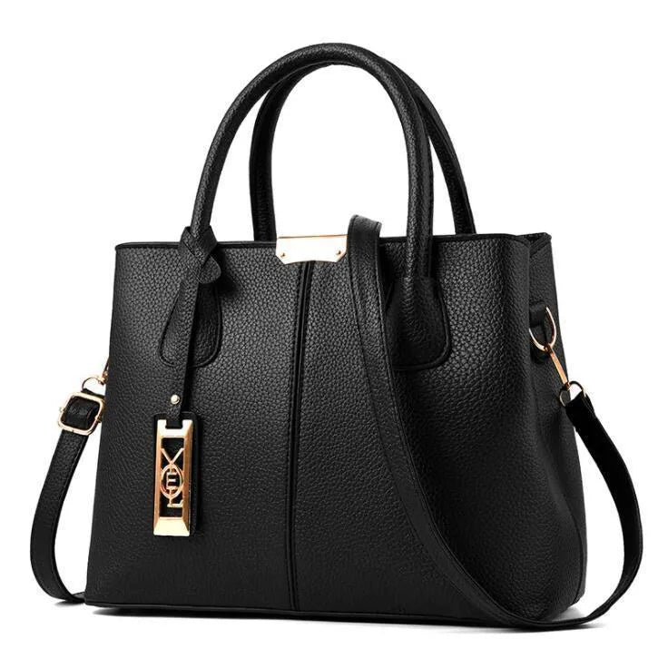 Soft large capacity PU leather shoulder bag in a horizontal square shape with a leather strap.