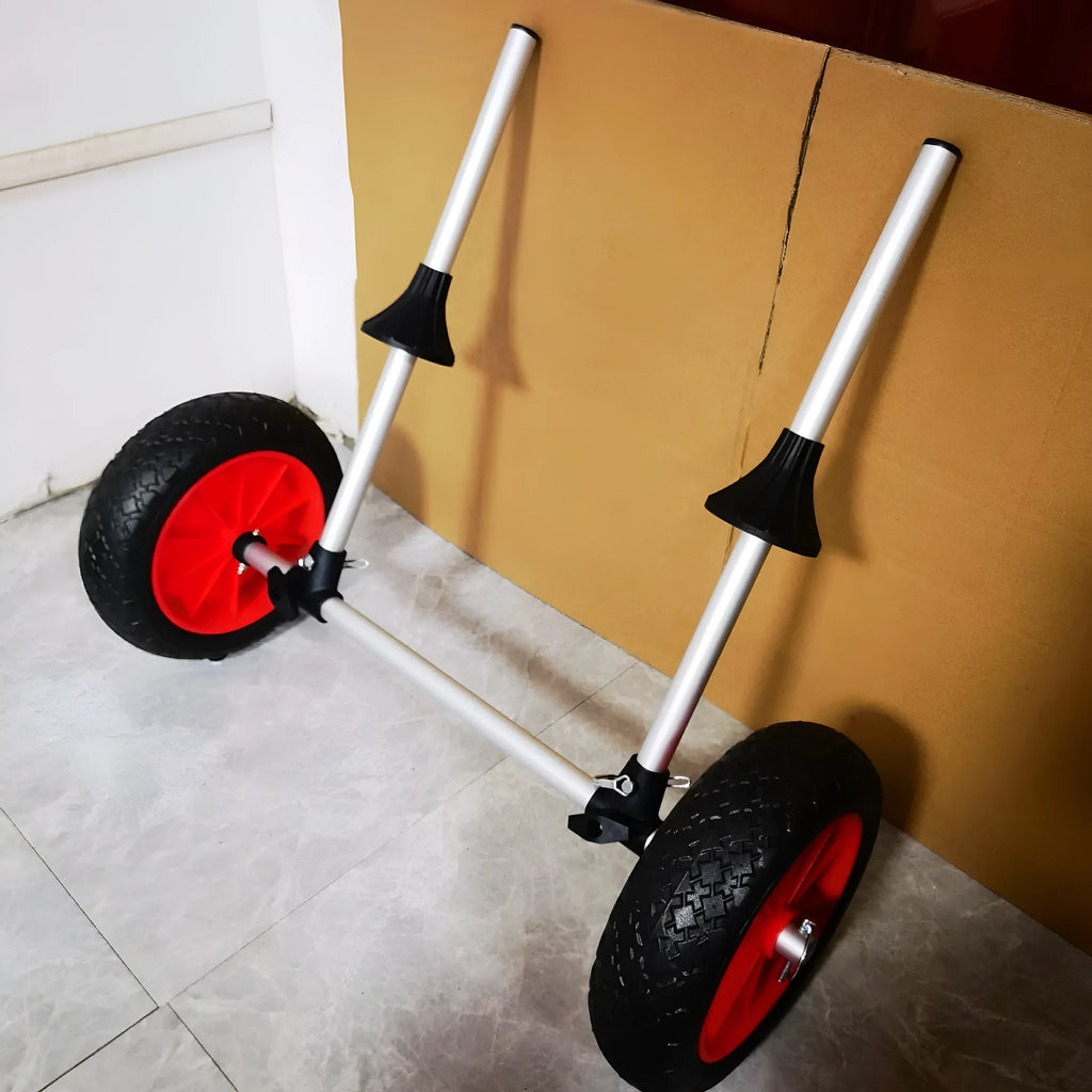 Foldable aluminium beach trailer for transporting kayaks and small boats on sand.