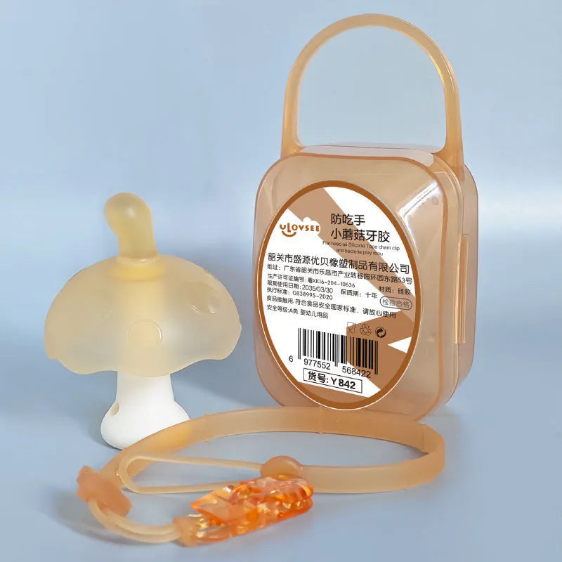 Small pink and nano colour mushroom-shaped silicone gel keychain charm on a transparent chain.