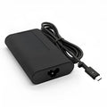 Black 65W USB-C laptop power adapter with multiple international power cords