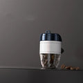 Coffee cup shaped plastic car air freshener in choice of five colours for vehicle odour removal.