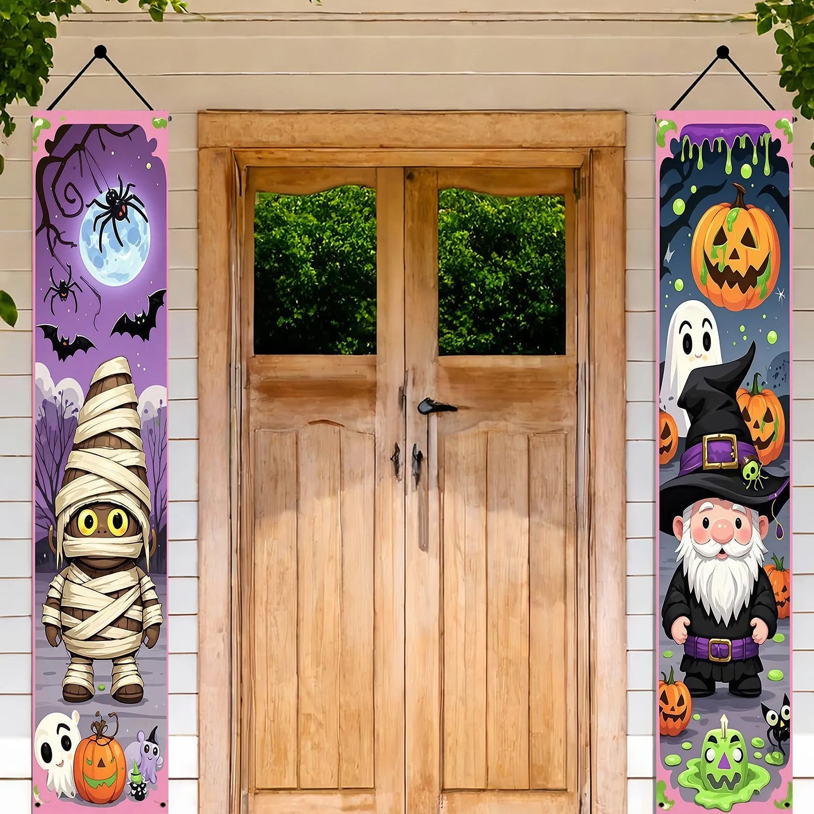 A pair of long Halloween-themed polyester banner decorations hanging on a wall.