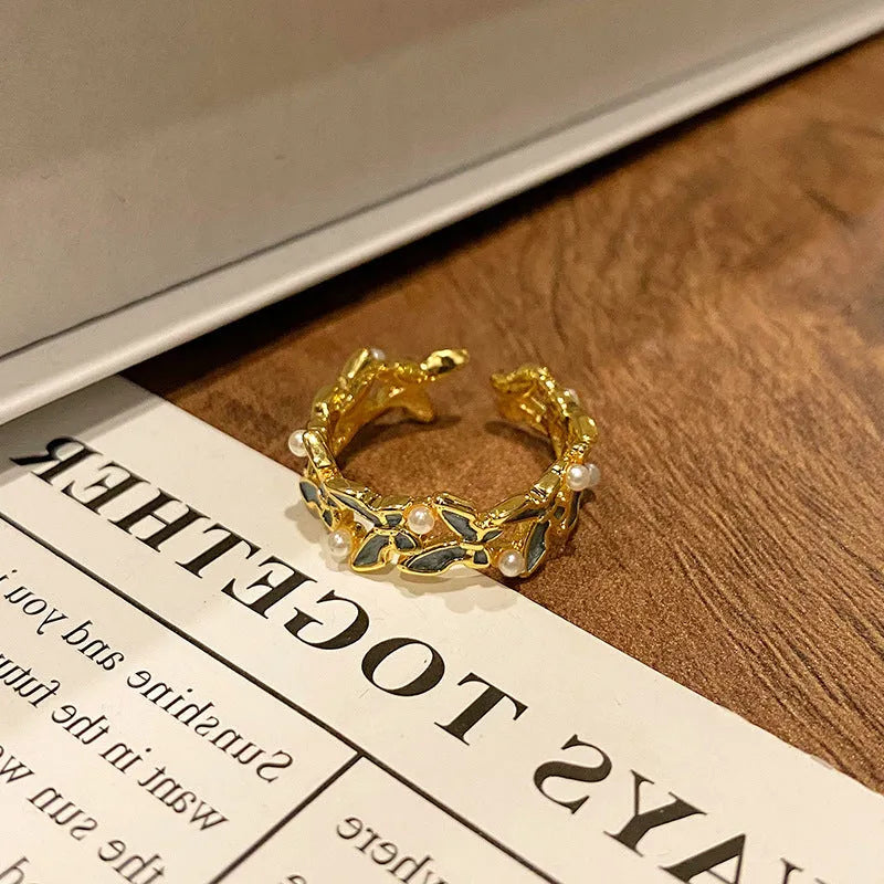 Butterfly women's copper ring with adjustable split ring design showing oil-drip colour treatment