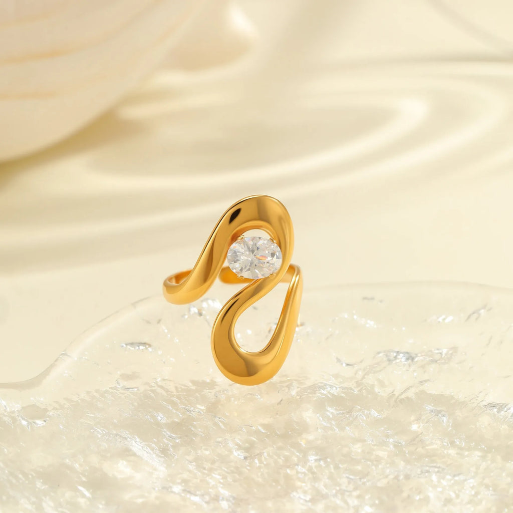 Geometric stainless steel zircon ring with open mouth adjustable design on a hand.