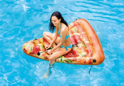 Large inflatable pizza-themed surfboard lounger floating on water.