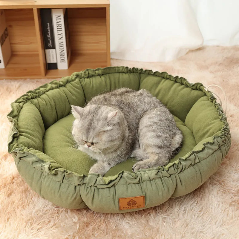 Grey reversible donut pet bed with raised bolsters for cats and small dogs
