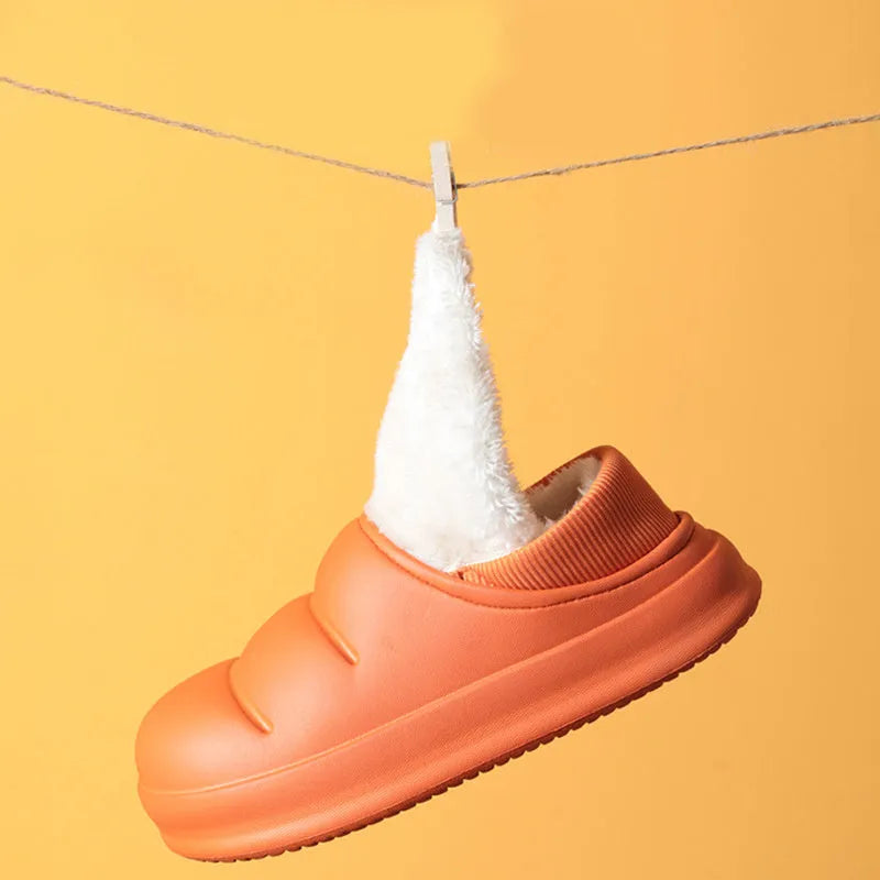 Women's waterproof EVA garden slippers in assorted colours with plush lining and non-slip soles.