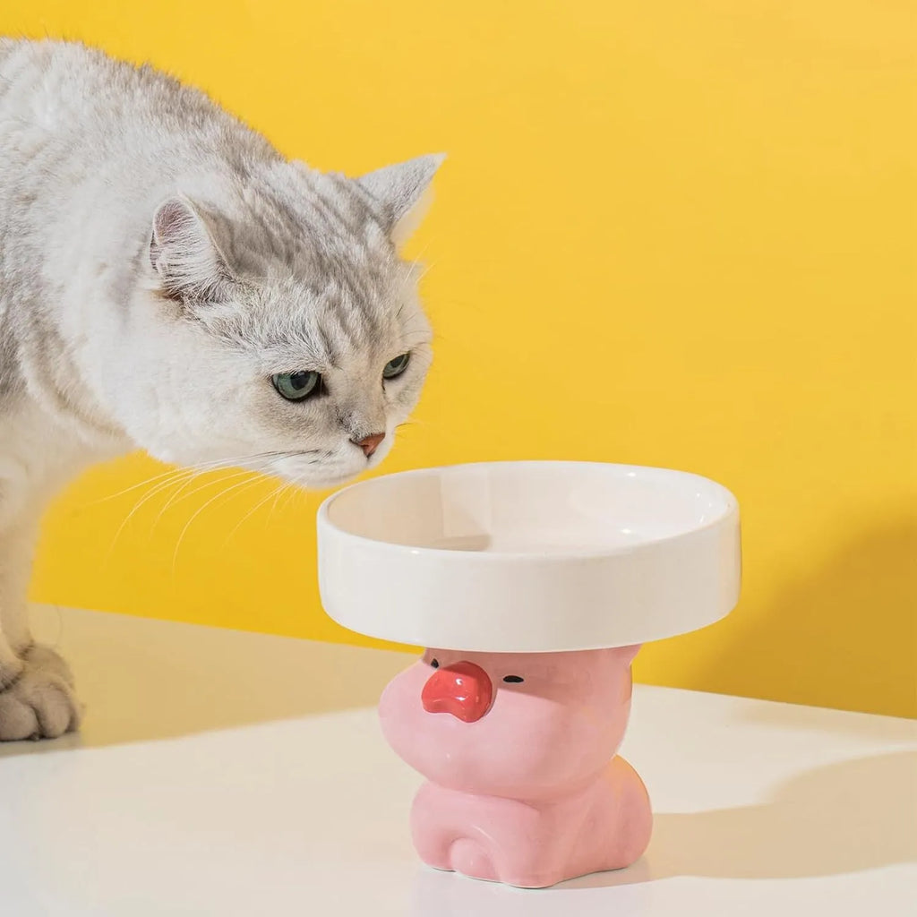 Raised ceramic cat food bowl in animal theme design, showing 12.5cm height and 15cm width.