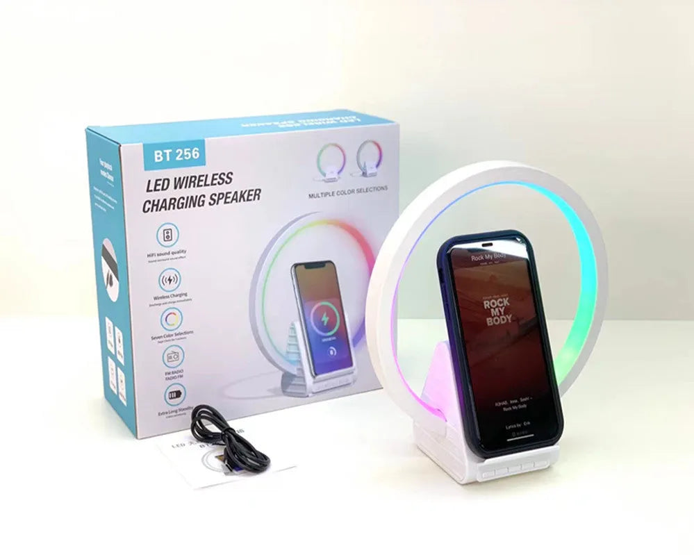 White Bluetooth speaker with ambient lighting and wireless charging pad measuring 225x200x10mm