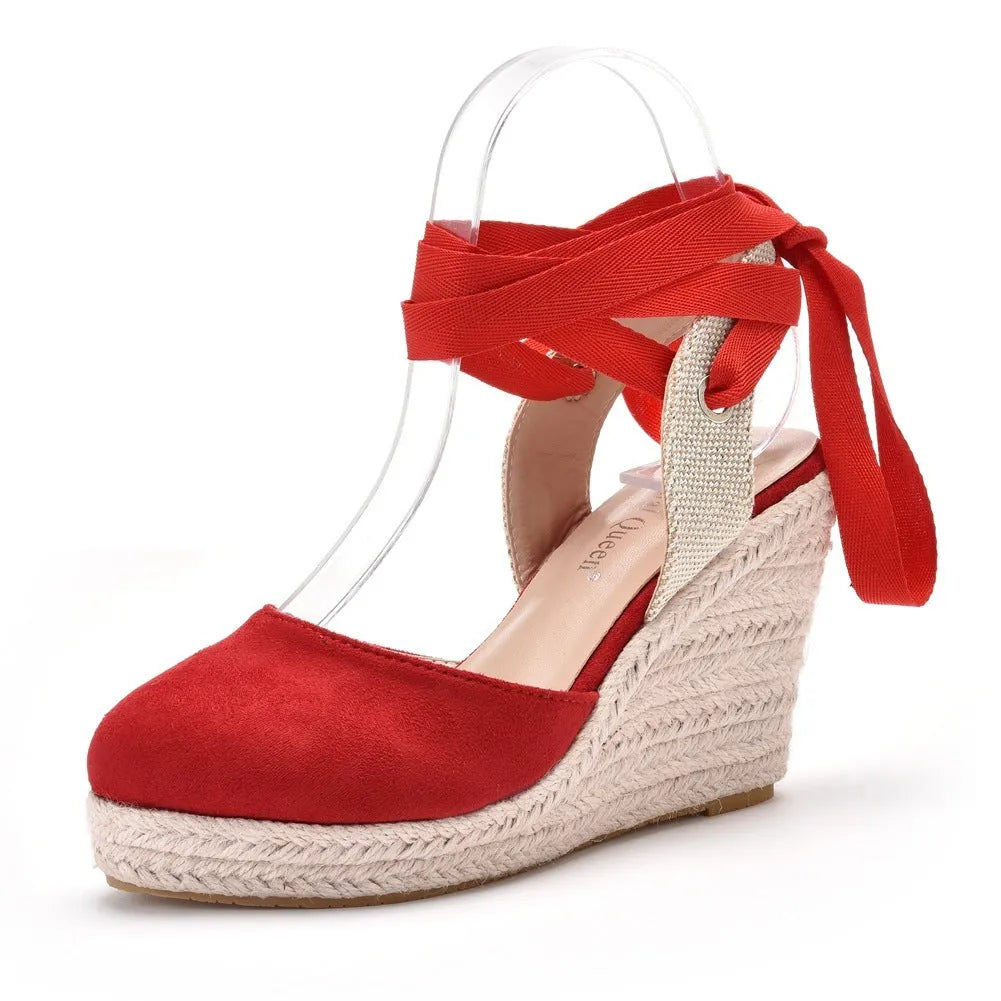 Women's bohemian wedge sandals with beading, tassels, buckle closure, and a wedge heel