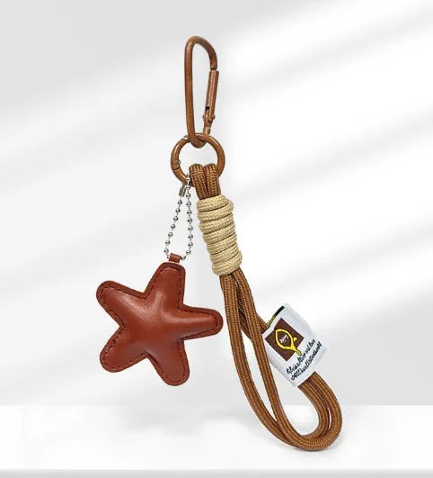Handmade soda bread style handbag pendant with cartoon pastry designs and brown strap