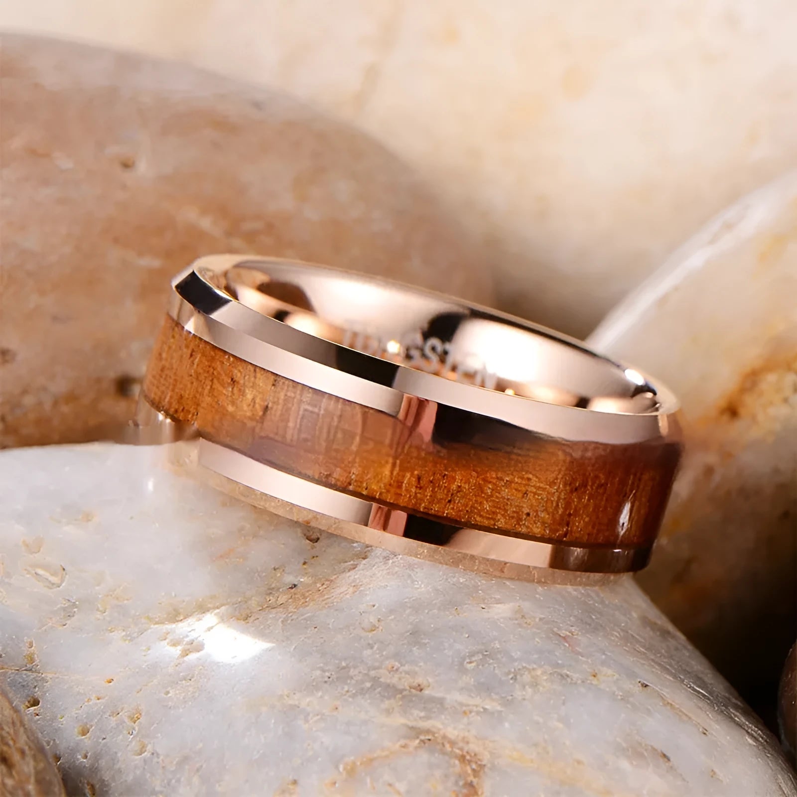 U-shaped tungsten men's ring with 8mm wide band in rose gold or steel finish on a grey background.