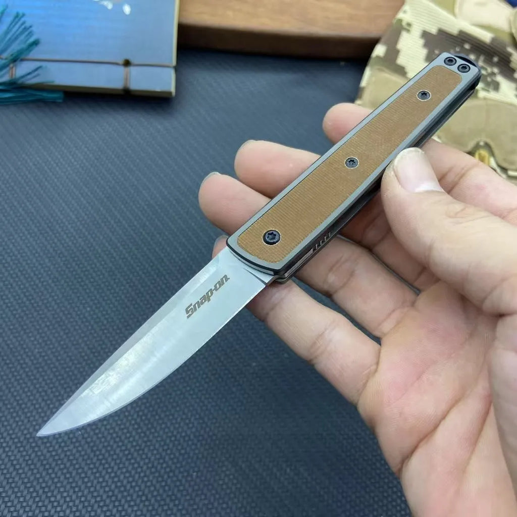 Folding fruit knife with stainless steel blade shown unfolded displaying 7cm blade length and 10cm handle
