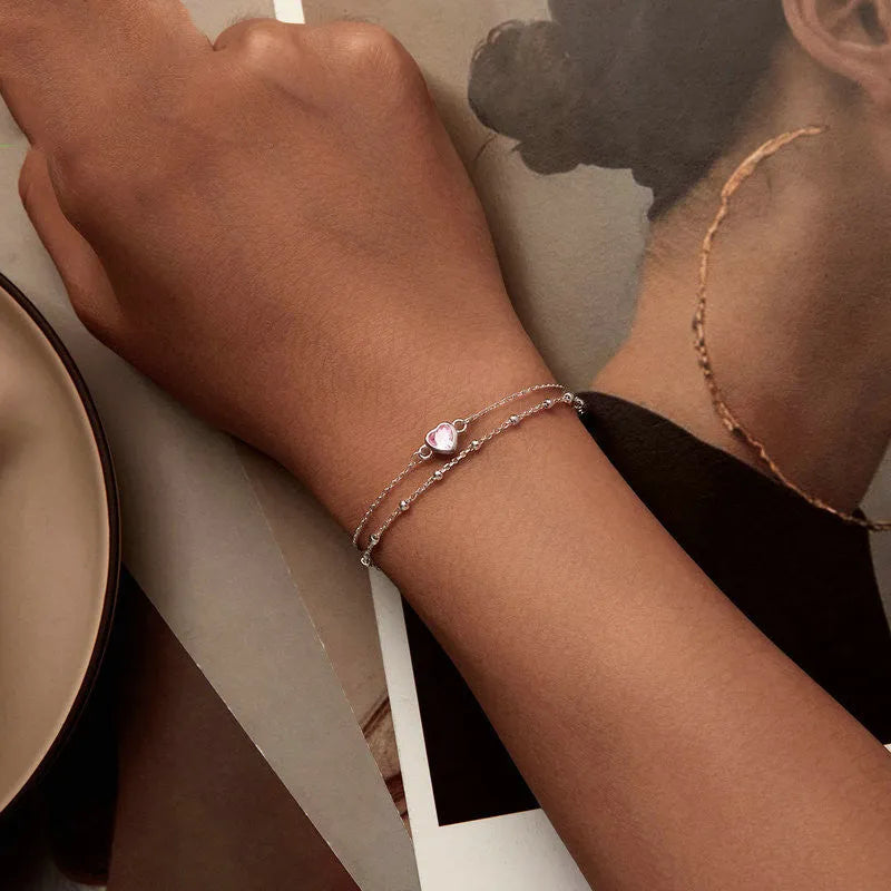 Women's sweet style 925 sterling silver bracelet with a small heart-shaped pendant on an adjustable chain.