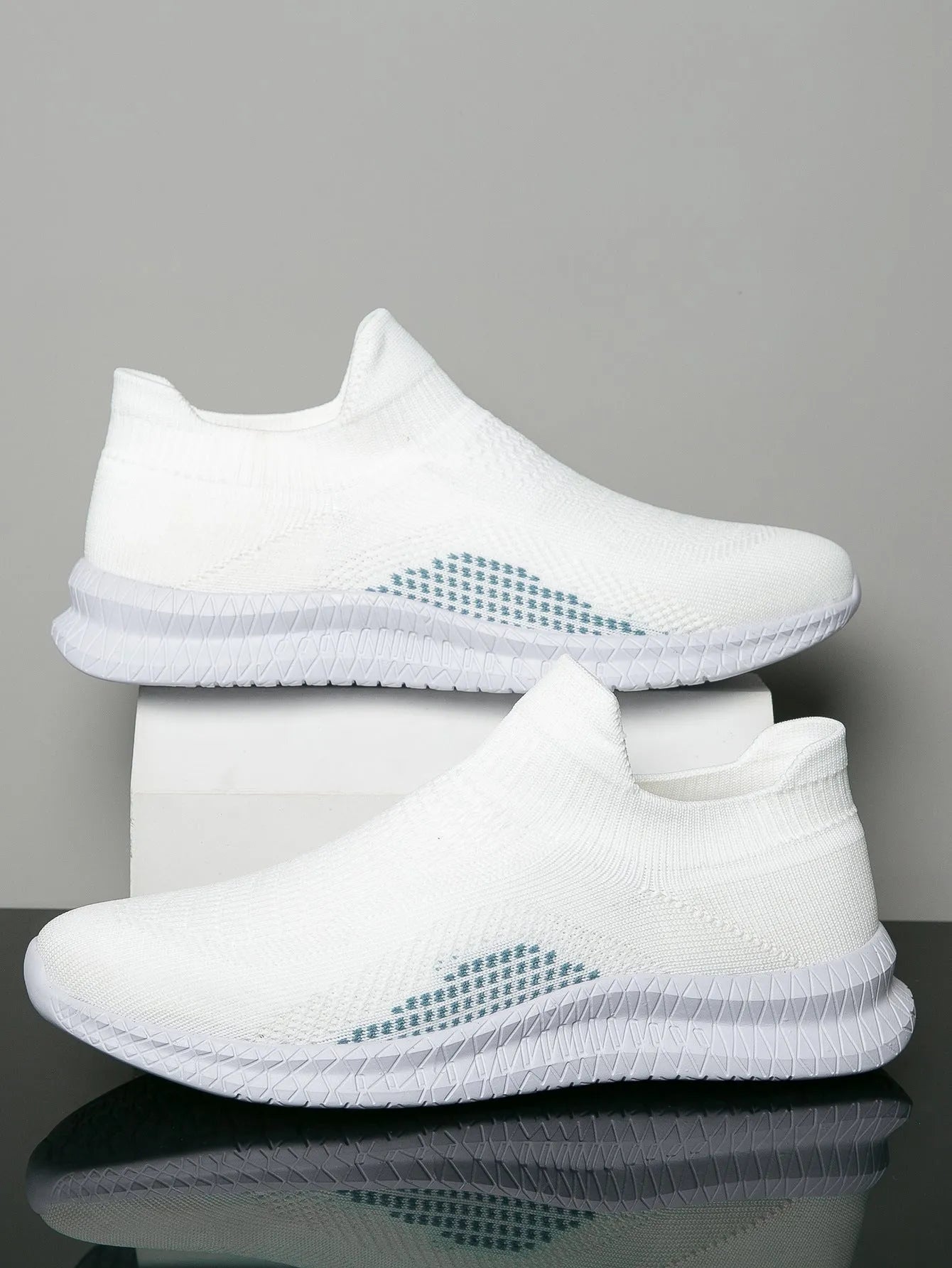 Popcorn Flyknit casual sneaker in low-top design with round toe, available in white, black, and blue colours