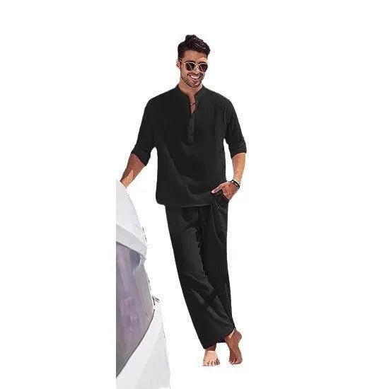 Man wearing a solid colour cotton long sleeve top and matching trousers from a casual suit.