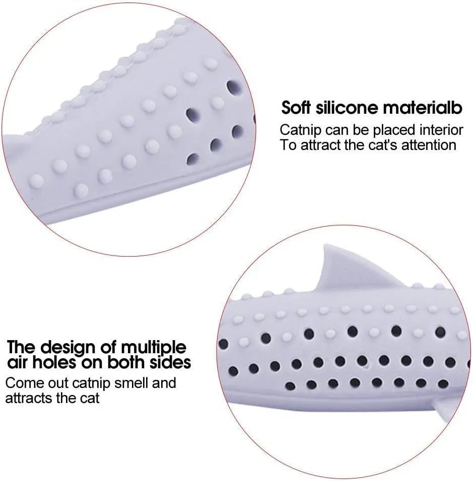 Green fish-shaped silicone chew toy for cats with visible side holes and a removable section for catnip.