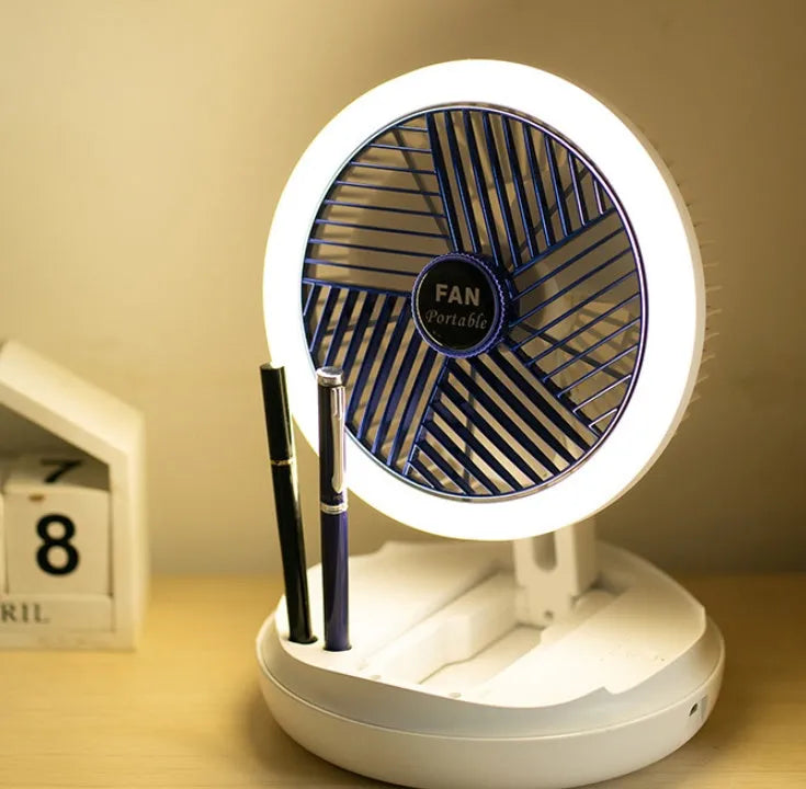 Blue foldable USB desk fan with LED light shown in open position on a table