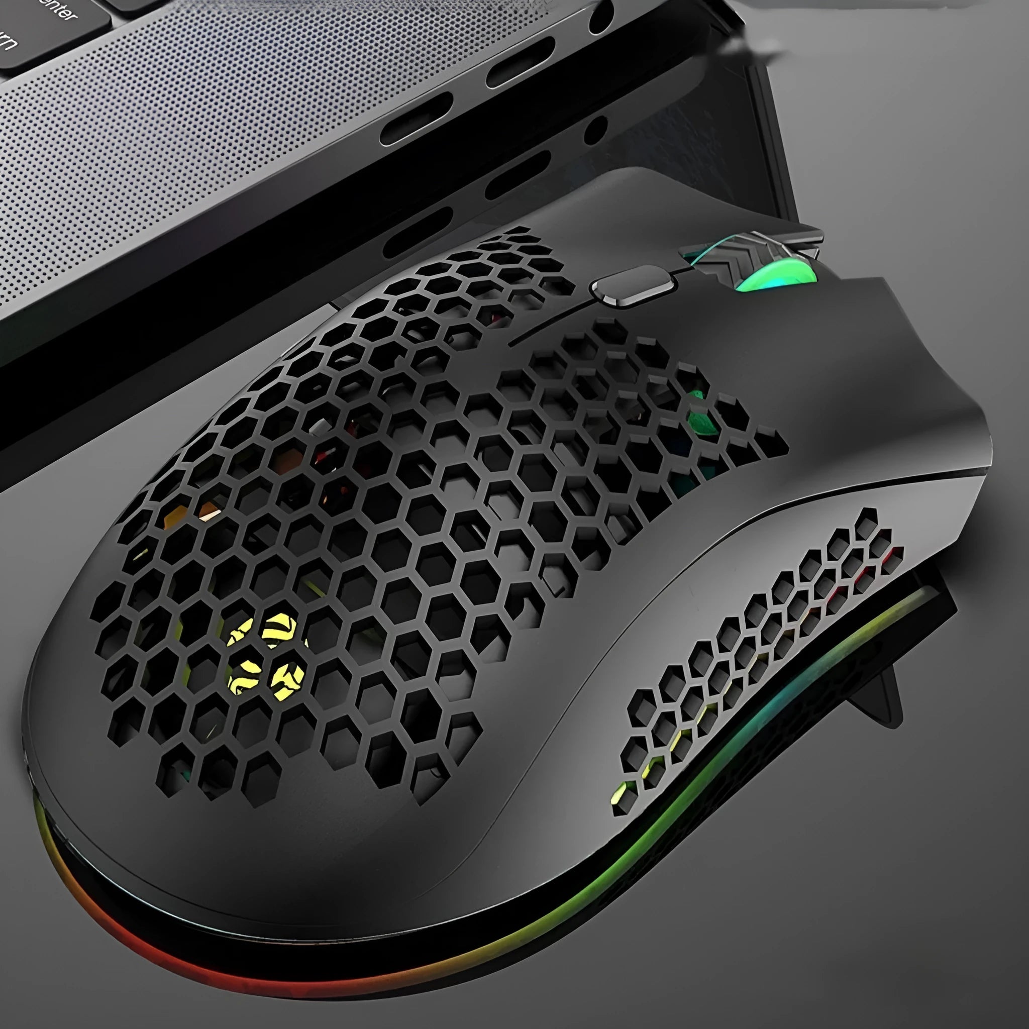 Hollow out patterned wireless gaming mouse with illumination, shown in cyan colour