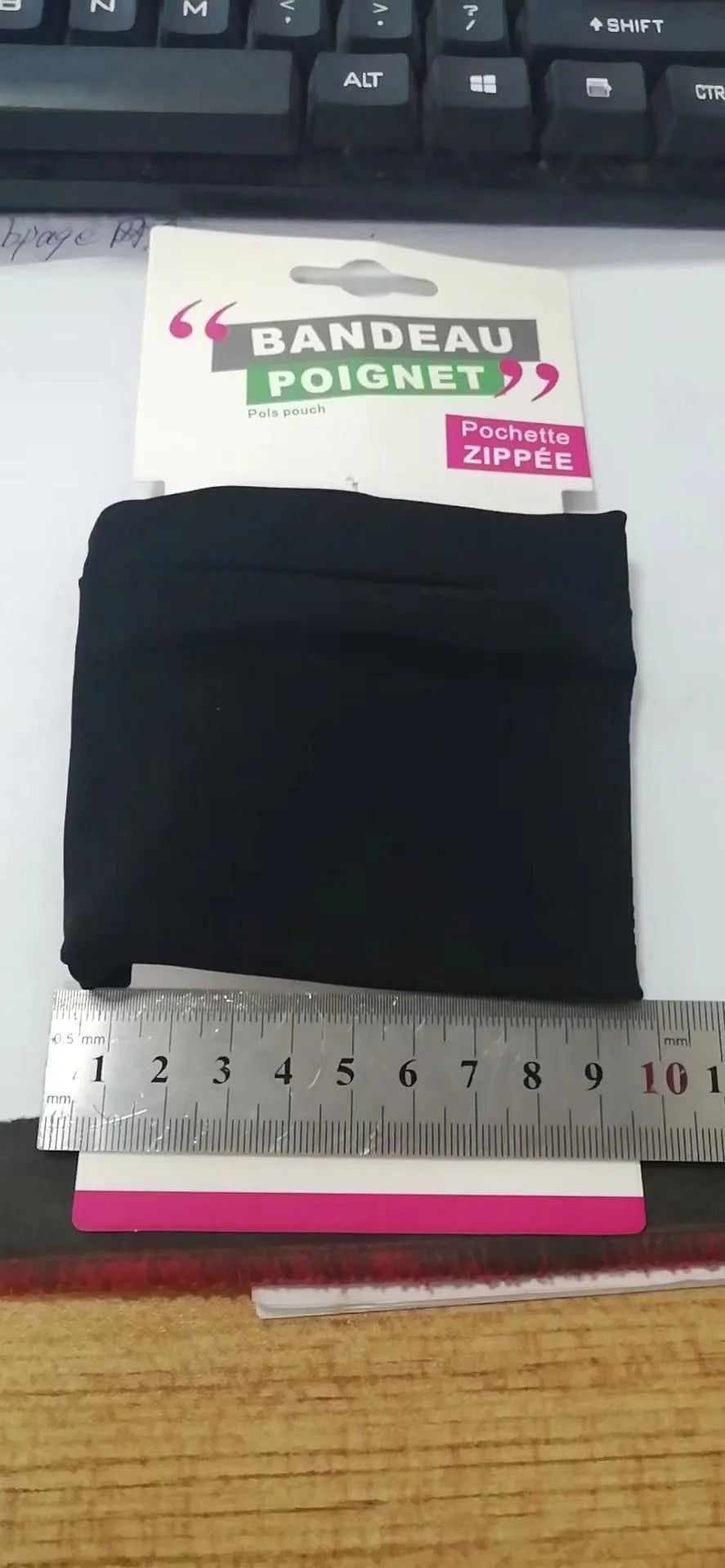 Adjustable fabric armband phone holder for wrists, shown with strap and 10x10.5cm phone compartment.