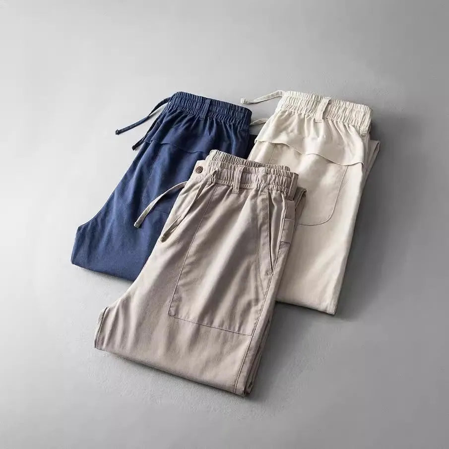 Men's mid waist linen casual trousers in navy blue, shown in a solid colour with a standard trousers length.