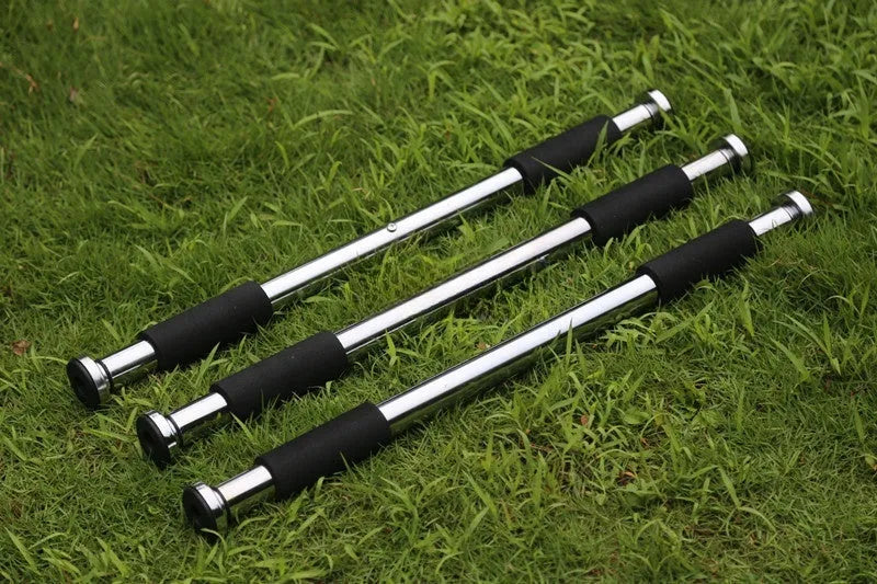Adjustable steel pull-up bar mounted in door frame for home fitness