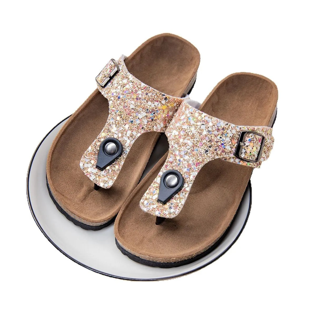 Children's cork flip-flops in gold with a hollow-out design and PVC sole.