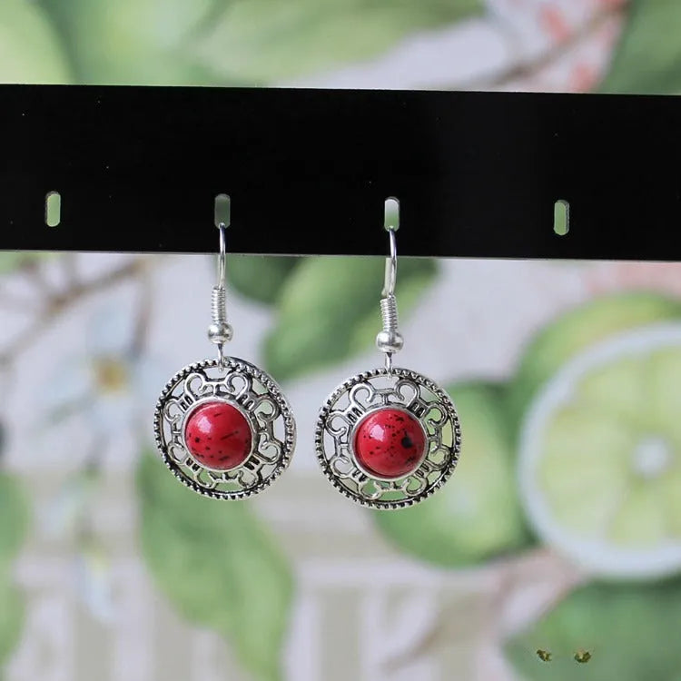 Ethnic Miao silver earrings with turquoise flower disk and geometric auspicious patterns