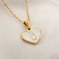 Gold-plated heart necklace with white shell accent and personalised letter pendant on stainless steel chain