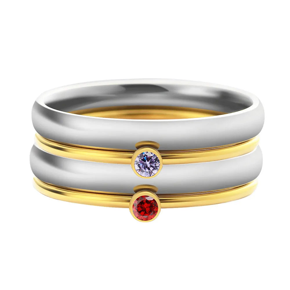 December birthstone titanium steel ring with geometric engraving, shown in gold and stone colours.