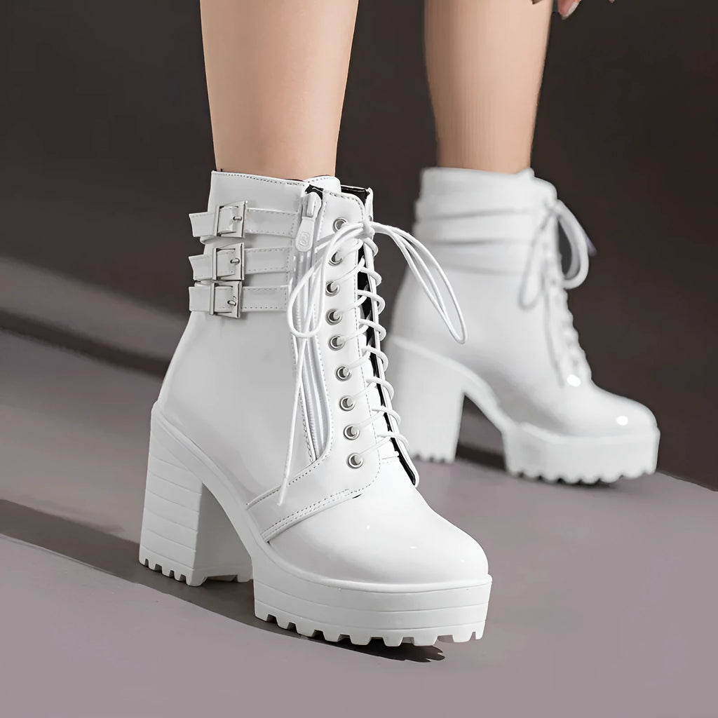 Women's black chunky heel ankle boots with front lace-up and round toe on a waterproof rubber sole.