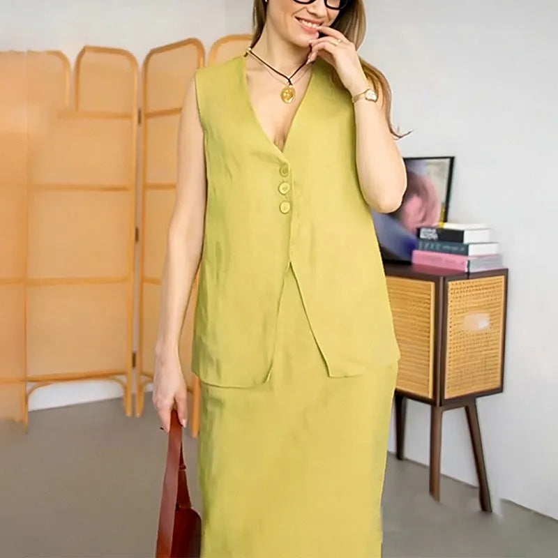 White sleeveless vest and long maxi skirt two-piece casual suit on a hanger.