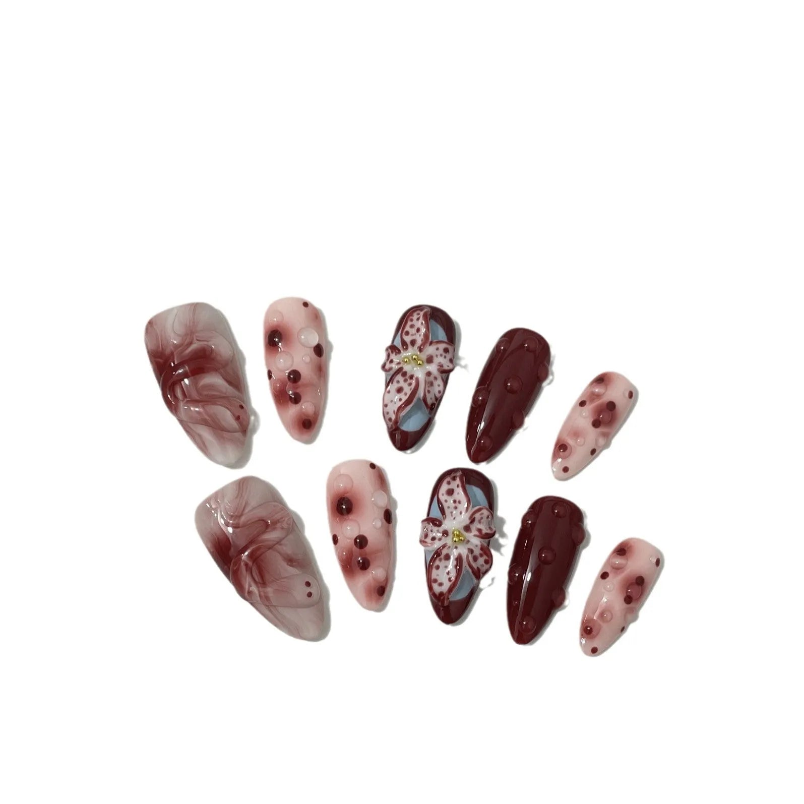 Almond shaped false nails with hand-painted 3D carved rose and tulip designs on a medium length nail.