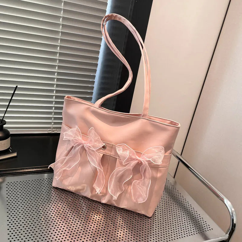 Black college style bow tote bag with large capacity and zipped internal compartments