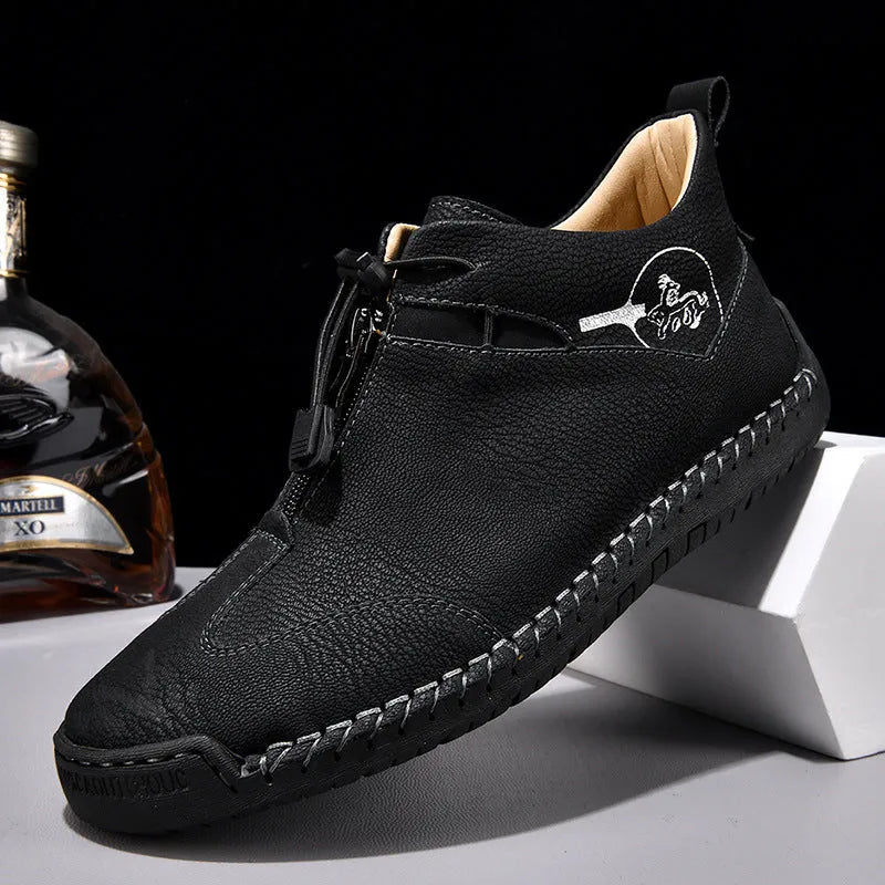 Men's black casual leather shoes with a mid-heel and rounded toe on a neutral background