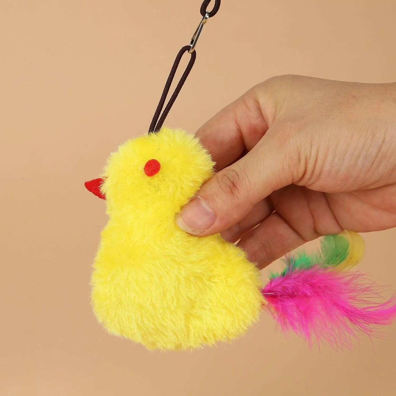 Interactive cat toy hanging from door frame with elastic rope and dangling mouse toy