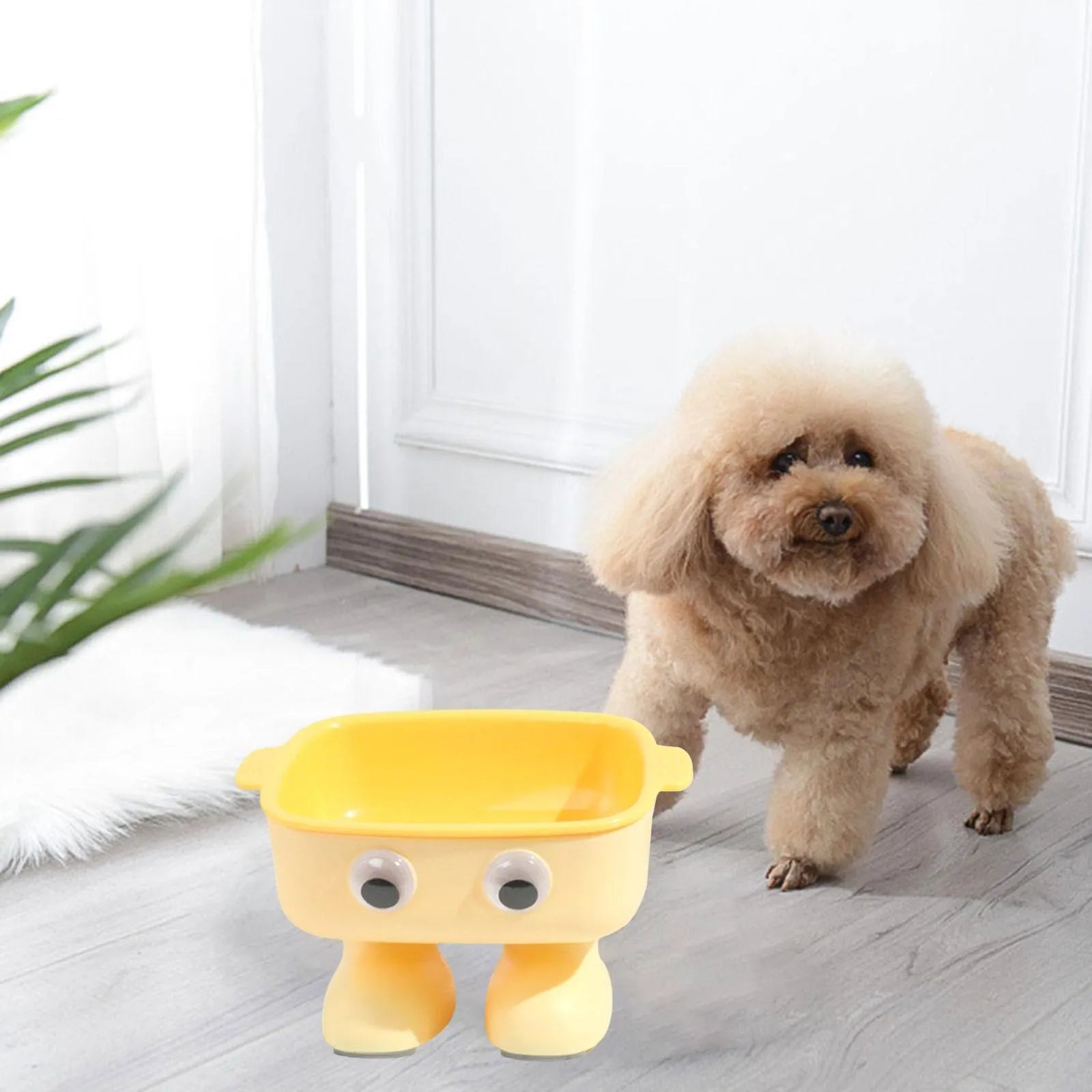 Green elevated cat bowl with cartoon robot design and 15° tilt angle