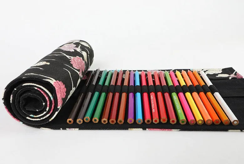 Canvas pencil case roll with ballet girl print, shown unrolled to display multiple pencil pockets.