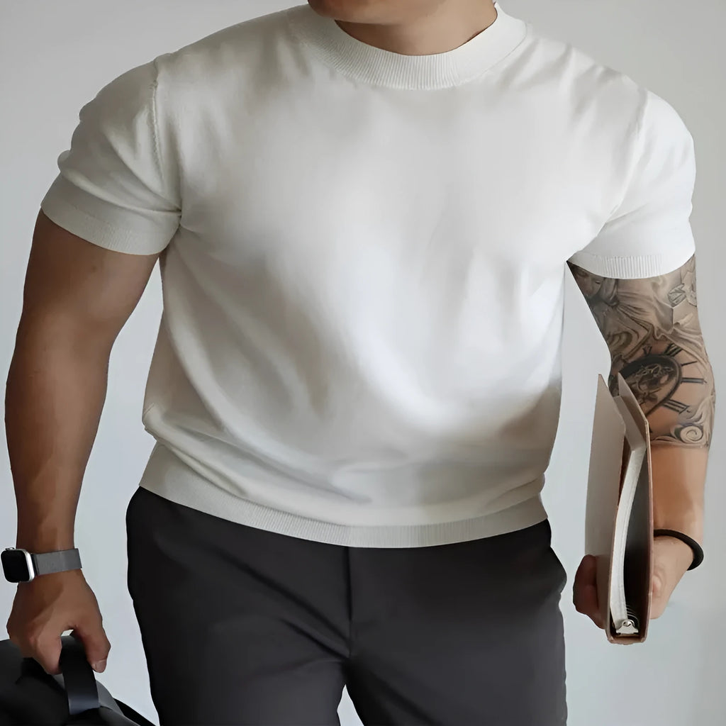 Men's slim fit solid colour t-shirt on a hanger, shown in a light neutral shade.