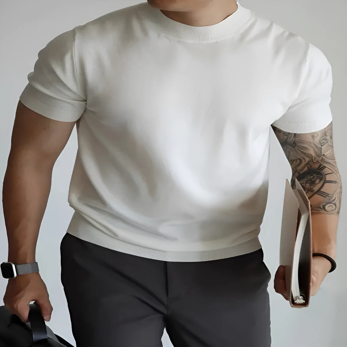 Men's slim fit solid colour t-shirt on a hanger, shown in a light neutral shade.